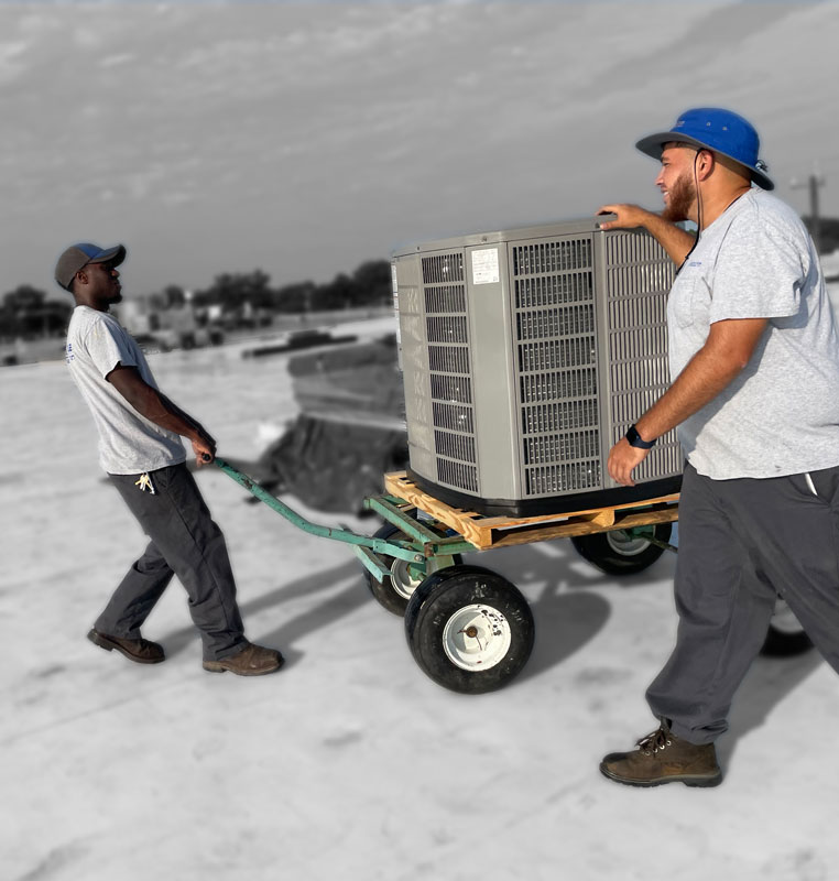 2-Guys-Pulling-AC-Unit